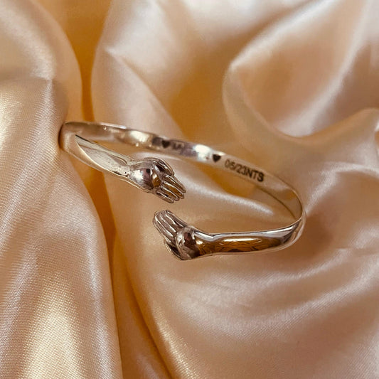 The Embrace – Hugging Hands Engravable Silver Bracelet