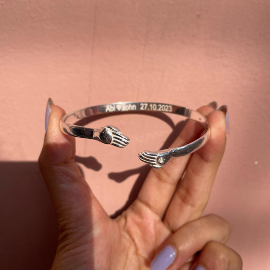 The Embrace – Hugging Hands Engravable Silver Bracelet